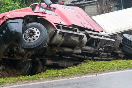 Semi-truck on its side