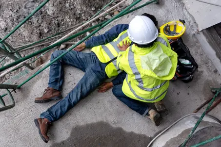 First aid support accident at work of construction worker at site.