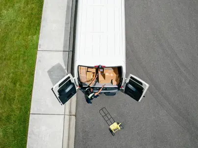 Delivery Woman Process Packages by Her Courier Vehicle